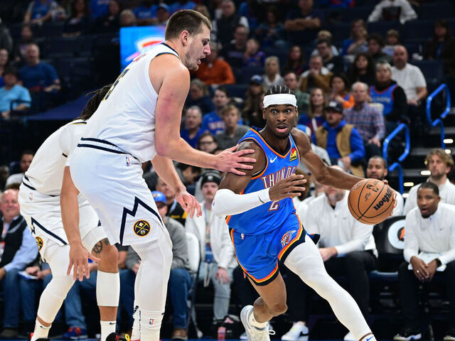 OKLAHOMA CITY, OKLAHOMA - OCTOBER 29: Shai Gilgeous-Alexander #2 of the Oklahoma City Thunder attempts to drive past Nikola Jokic #15 of the Denver Nuggets during the first quarter of a game at Paycom Center on October 29, 2023 in Oklahoma City, Oklahoma.