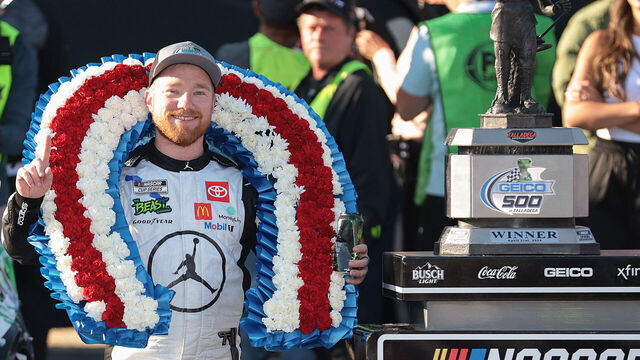 TALLADEGA, ALABAMA - APRIL 21: Tyler Reddick, driver of the #45 Jordan Brand Toyota, celebrates in victory lane after winning the NASCAR Cup Series GEICO 500 at Talladega Superspeedway on April 21, 2024 in Talladega, Alabama.
