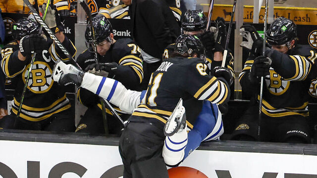 Boston, MA - April 20: Boston Bruins left wing Pat Maroon checks Toronto Maple Leafs defenseman Timothy Liljegren into the Bruins bench in the first period.