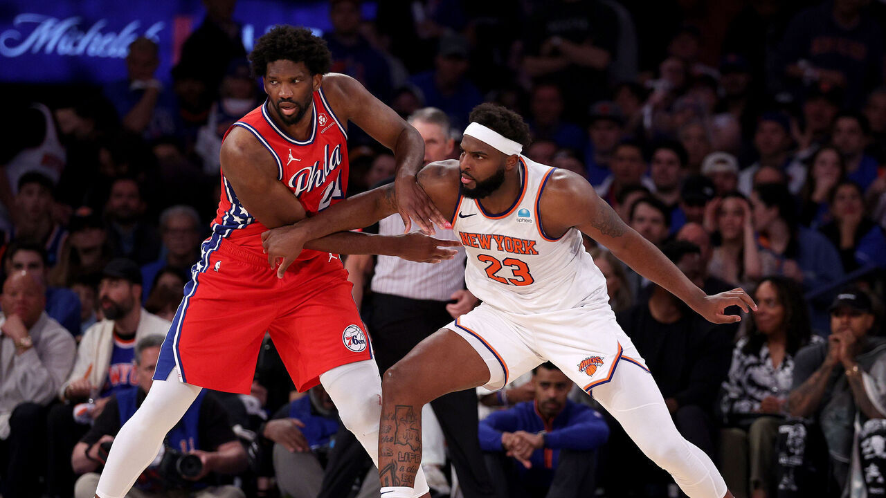 NEW YORK, NEW YORK - APRIL 20: Joel Embiid #21 of the Philadelphia 76ers and Mitchell Robinson #23 of the New York Knicks fight for position during the second half in game one of the Eastern Conference First Round Playoffs at Madison Square Garden on April 20, 2024 in New York City. The New York Knicks defeated the Philadelphia 76ers 111-104.