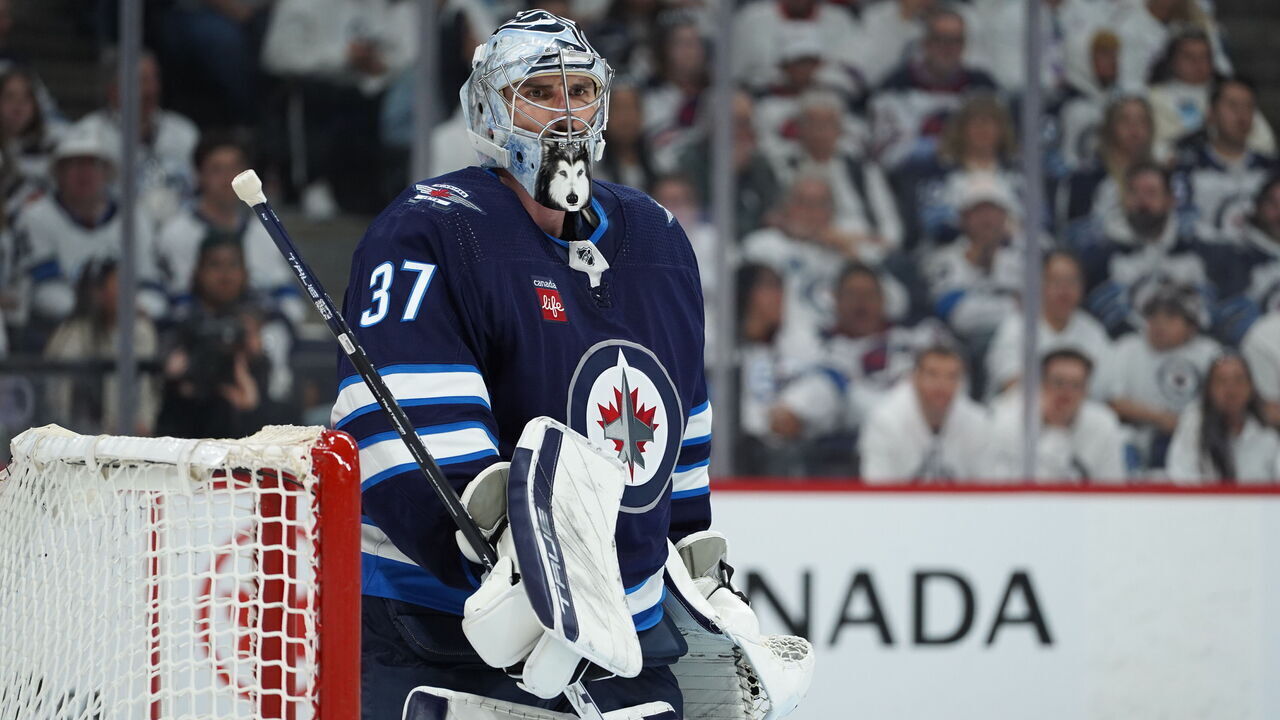 WINNIPEG, CANADA - APRIL 21: Connor Hellebuyck #37 of Winnipeg Jets looks on during action against the Colorado Avalanche in Game One of the First Round of the 2024 Stanley Cup Playoffs at Canada Life Centre on April 21, 2024, in Winnipeg, Canada.