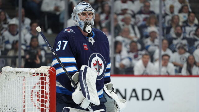 WINNIPEG, CANADA - APRIL 21: Connor Hellebuyck #37 of Winnipeg Jets looks on during action against the Colorado Avalanche in Game One of the First Round of the 2024 Stanley Cup Playoffs at Canada Life Centre on April 21, 2024, in Winnipeg, Canada.