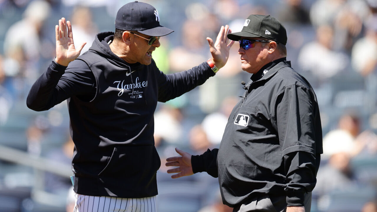 NEW YORK, NEW YORK - APRIL 22: Aaron Boone #17 of the New York Yankees argues with third base umpire Marvin Hudson #51 in the first inning during the game against the Oakland Athletics at Yankee Stadium on April 22, 2024 in New York City.