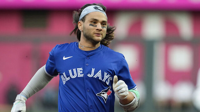 KANSAS CITY, MISSOURI - APRIL 22: Bo Bichette #11 of the Toronto Blue Jays heads to third after hitting a three-run triple in the third inning against the Kansas City Royals at Kauffman Stadium on April 22, 2024 in Kansas City, Missouri.