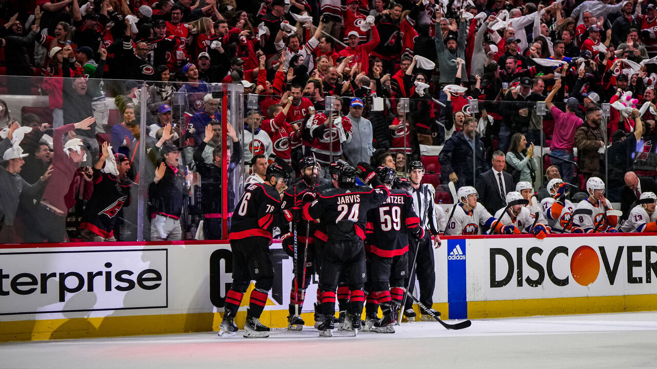RALEIGH, NORTH CAROLINA - APRIL 22: Sebastian Aho #20 of the Carolina Hurricanes celebrates with teammates after a goal during the third period against the New York Islanders in Game Two of the First Round of the 2024 Stanley Cup Playoffs at PNC Arena on April 22, 2024 in Raleigh, North Carolina.