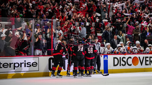 RALEIGH, NORTH CAROLINA - APRIL 22: Sebastian Aho #20 of the Carolina Hurricanes celebrates with teammates after a goal during the third period against the New York Islanders in Game Two of the First Round of the 2024 Stanley Cup Playoffs at PNC Arena on April 22, 2024 in Raleigh, North Carolina.