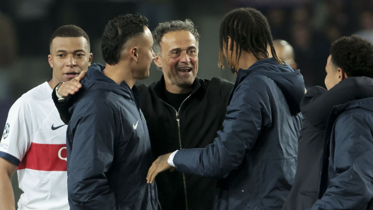 BARCELONA, SPAIN - APRIL 16: PSG coach Luis Enrique celebrates the victory with Kylian Mbappe, PSG goalkeeper Keylor Navas, Bradley Barcola following the UEFA Champions League quarter-final second leg match between FC Barcelona (Barca) and Paris Saint-Germain (PSG) at Estadi Olimpic Lluis Companys on April 16, 2024 in Barcelona, Spain.