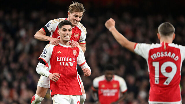 LONDON, ENGLAND - APRIL 23: Kai Havertz of Arsenal celebrates scoring his team's fourth goal with teammate Martin Odegaard during the Premier League match between Arsenal FC and Chelsea FC at Emirates Stadium on April 23, 2024 in London, England.