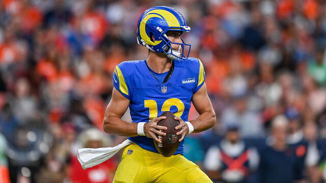 DENVER, COLORADO - AUGUST 26: Quarterback Stetson Bennett #13 of the Los Angeles Rams shows a passes in the first quarter against the Denver Broncos in a preseason game at Empower Field at Mile High on August 26, 2023 in Denver, Colorado.