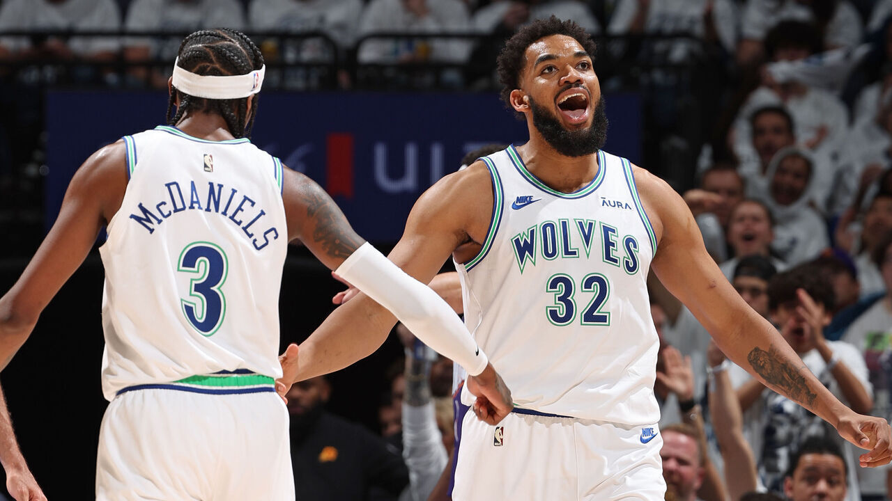 MINNEAPOLIS, MN - APRIL 23: Karl-Anthony Towns #32 and Jaden McDaniels #3 of the Minnesota Timberwolves high five during the game against the Phoenix Suns during Round 1 Game 2 of the 2024 NBA Playoffs on April 23, 2024 at Target Center in Minneapolis, Minnesota. Mandatory Copyright Notice: Copyright 2024 NBAE