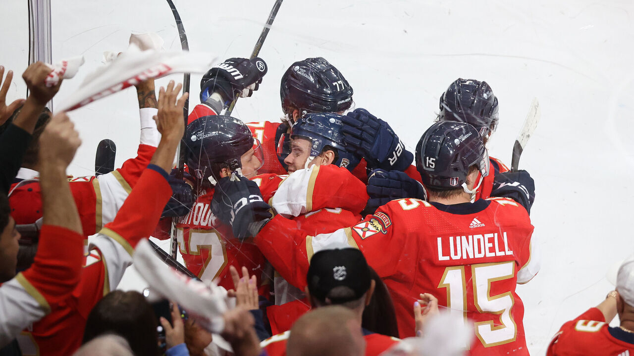 SUNRISE, FL - APRIL 23: Teammates congratulate Carter Verhaeghe #23 of the Florida Panthers after he scored the game-winning goal in overtime against the Tampa Bay Lightning in Game Two of the First Round of the 2024 Stanley Cup Playoffs at the Amerant Bank Arena on April 23, 2024 in Sunrise, Florida. The Panthers won 3-2.