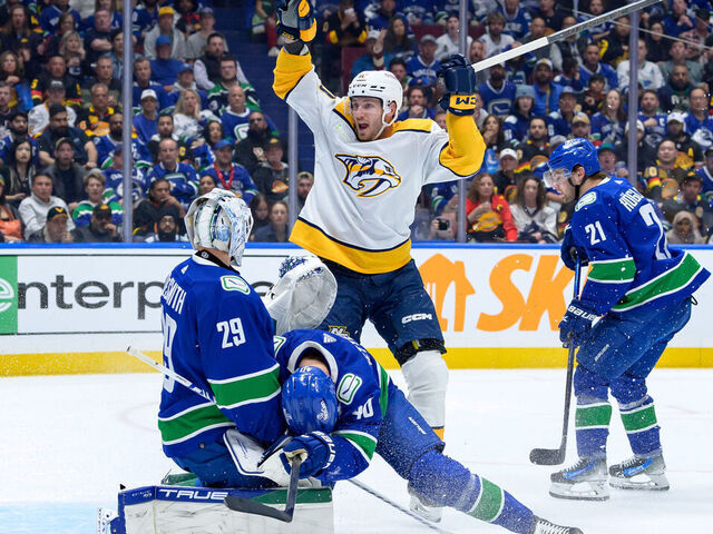 VANCOUVER, CANADA - APRIL 23: Elias Pettersson #40 and Casey DeSmith #29 of the Vancouver Canucks look on dejected as Colton Sissons #10 of the Nashville Predators celebrates after scoring during the 2nd period in Game Two of the First Round of the 2024 Stanley Cup Playoffs at Rogers Arena on April 23, 2024 in Vancouver, British Columbia, Canada.