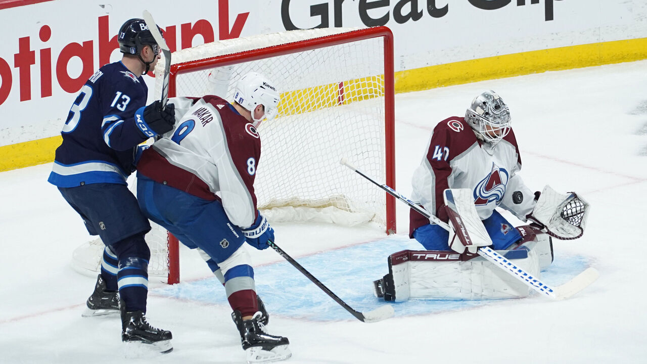 WINNIPEG, CANADA - APRIL 23: Alexandar Georgiev #40 of the Colorado Avalanche makes a save against the Winnipeg Jets in Game Two of the First Round of the 2024 Stanley Cup Playoffs at Canada Life Centre on April 23, 2024, in Winnipeg, Canada.