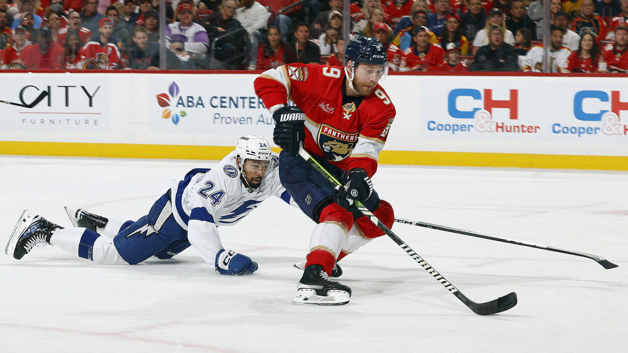 SUNRISE, FLORIDA - APRIL 23: Sam Bennett #9 of the Florida Panthers skates with the puck against Mathew Dumba #24 of the Tampa Bay Lightning in Game Two of the First Round of the 2024 Stanley Cup Playoffs at the Amerant Bank Arena on April 23, 2024 in Sunrise, Florida.