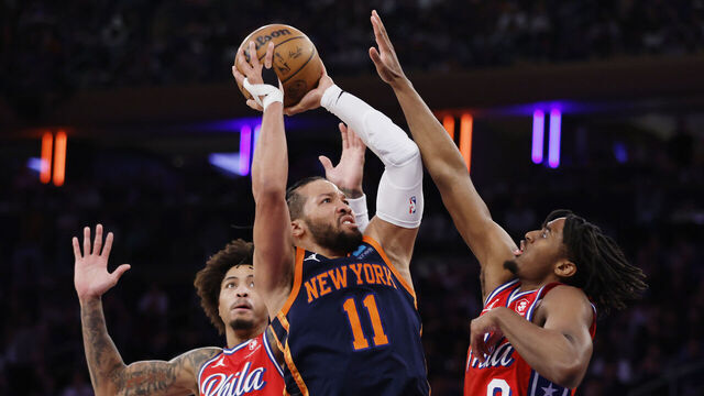 NEW YORK, NEW YORK - APRIL 22: Jalen Brunson #11 of the New York Knicks goes to the basket against Kelly Oubre Jr. #9 and Tyrese Maxey #0 of the Philadelphia 76ers during the second half in Game Two of the Eastern Conference First Round Playoffs at Madison Square Garden on April 22, 2024 in New York City. The Knicks won 104-101.
