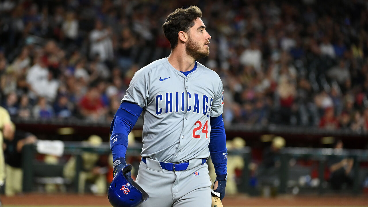 PHOENIX, ARIZONA - APRIL 16: Cody Bellinger #24 of the Chicago Cubs walks back to his dugout against the Arizona Diamondbacks at Chase Field on April 16, 2024 in Phoenix, Arizona.