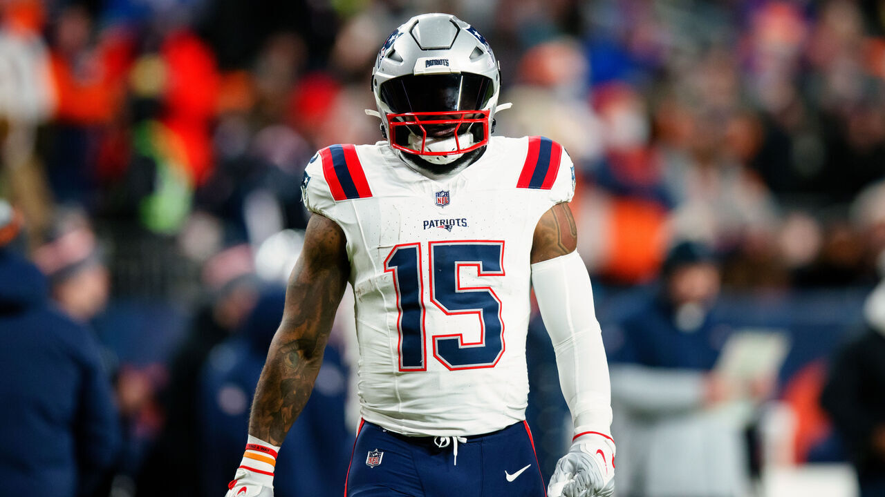 DENVER, CO - JANUARY 24: Running back Ezekiel Elliott #15 of the New England Patriots walks on the field during the first quarter against the Denver Broncos at Empower Field at Mile High on December 24, 2023 in Denver, Colorado.