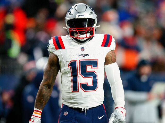 DENVER, CO - JANUARY 24: Running back Ezekiel Elliott #15 of the New England Patriots walks on the field during the first quarter against the Denver Broncos at Empower Field at Mile High on December 24, 2023 in Denver, Colorado.