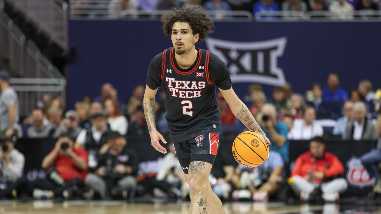 KANSAS CITY, MO - MARCH 15: Texas Tech Red Raiders guard Pop Isaacs (2) brings the ball up court in the first half of a Big 12 tournament semifinal game between the Texas Tech Red Raiders and Houston Cougars on Mar 15, 2024 at T-Mobile Center in Kansas City, MO.