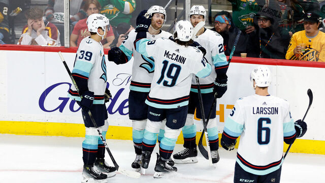 ST PAUL, MINNESOTA - APRIL 18: Tye Kartye #52 of the Seattle Kraken (C) celebrates his goal against the Minnesota Wild with teammates in the third period at Xcel Energy Center on April 18, 2024 in St Paul, Minnesota. The Kraken defeated the Wild 4-3.