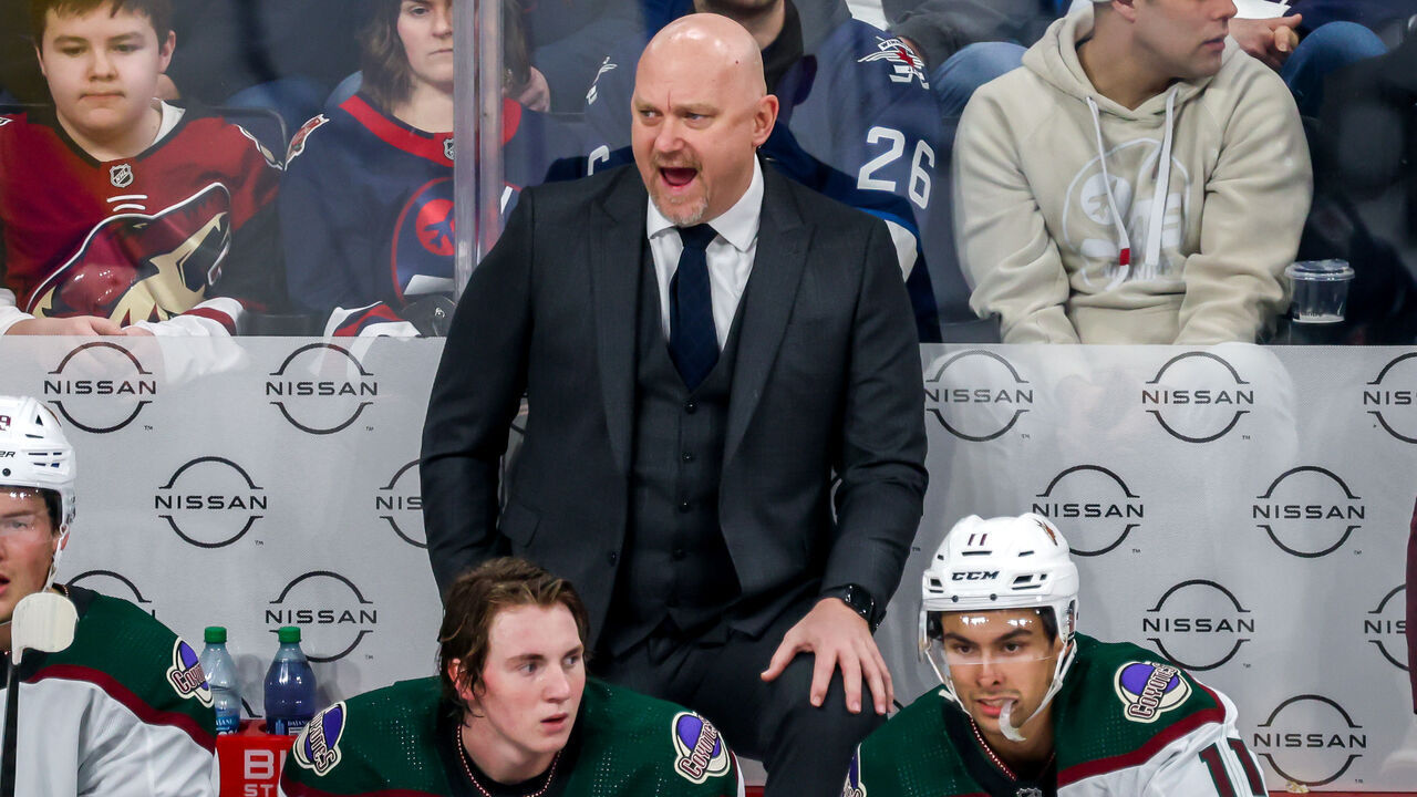 WINNIPEG, CANADA - FEBRUARY 25: Head coach André Tourigny of the Arizona Coyotes calls out instructions from the bench during third period action against the Winnipeg Jets at Canada Life Centre on February 25, 2024 in Winnipeg, Manitoba, Canada.
