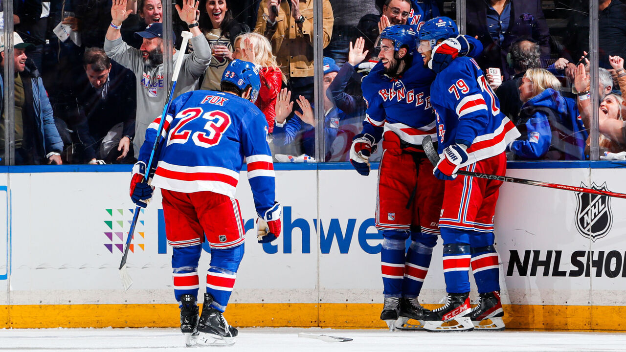 NEW YORK, NEW YORK - APRIL 23: K'Andre Miller #79, Mika Zibanejad #93 and Adam Fox #23 of the New York Rangers celebrate a second period goal against the Washington Capitals in Game Two of the First Round of the 2024 Stanley Cup Playoffs at Madison Square Garden on April 23, 2024 in New York City.