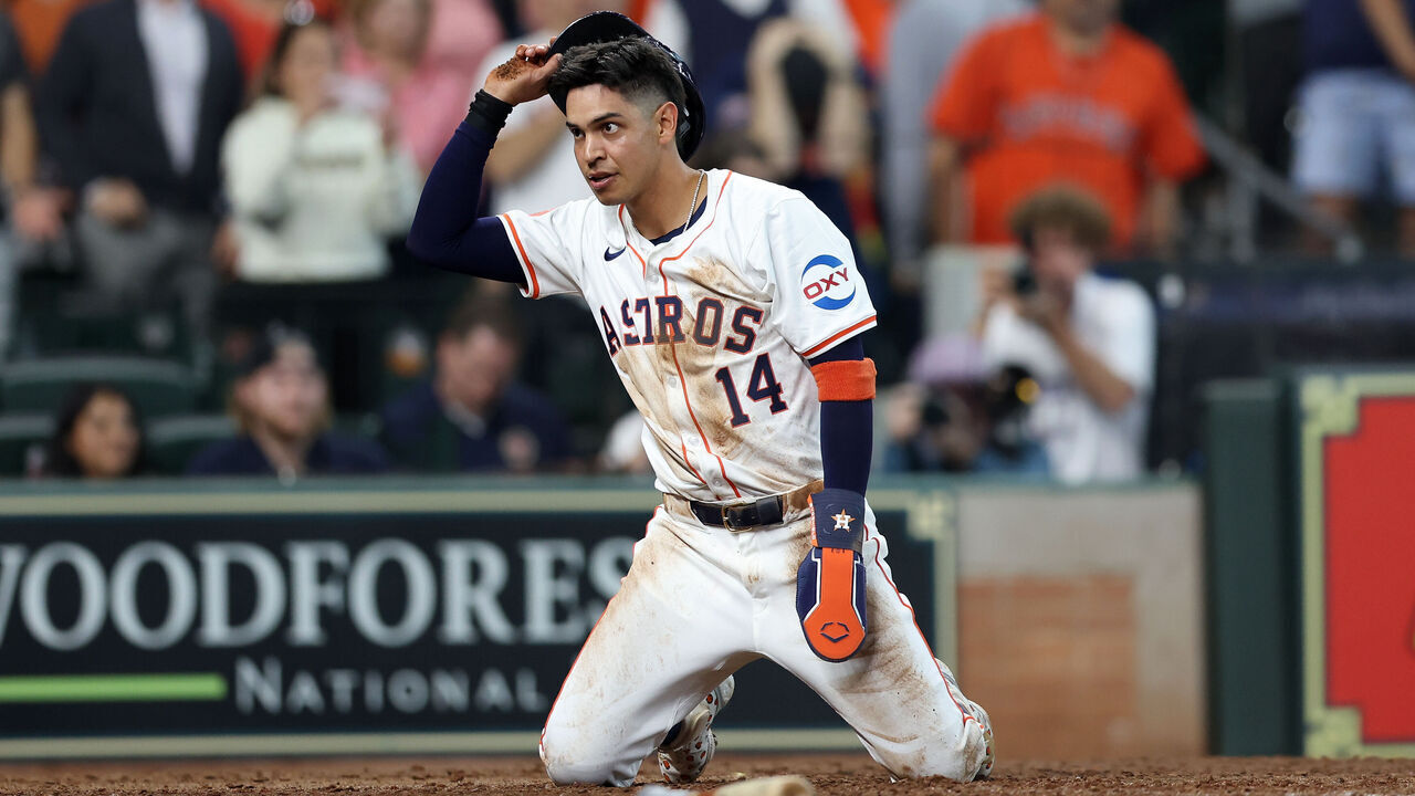 HOUSTON, TEXAS - MARCH 28: Mauricio Dubon #14 of the Houston Astros reacts after being thrown out at home plate in the ninth inning against the New York Yankees during Opening Day at Minute Maid Park on March 28, 2024 in Houston, Texas.