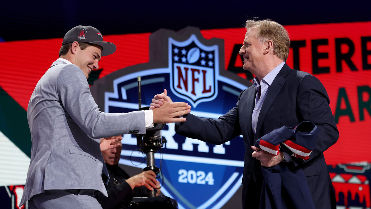 DETROIT, MICHIGAN - APRIL 25: (L-R) Drake Maye celebrates with NFL Commissioner Roger Goodell after being selected third overall by the New England Patriots during the first round of the 2024 NFL Draft at Campus Martius Park and Hart Plaza on April 25, 2024 in Detroit, Michigan.
