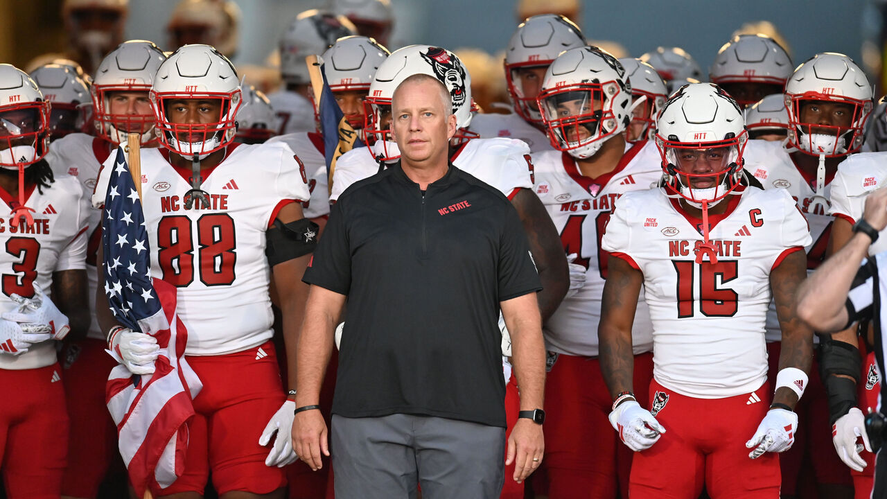 EAST HARTFORD, CT - AUGUST 31: North Carolina State Wolfpack head coach Dave Doeren leads the team out onto the field prior to the game as the North Carolina State Wolfpack take on the UConn Huskies on August 31, 2023, at the Rentschler Field in East Hartford, Connecticut.