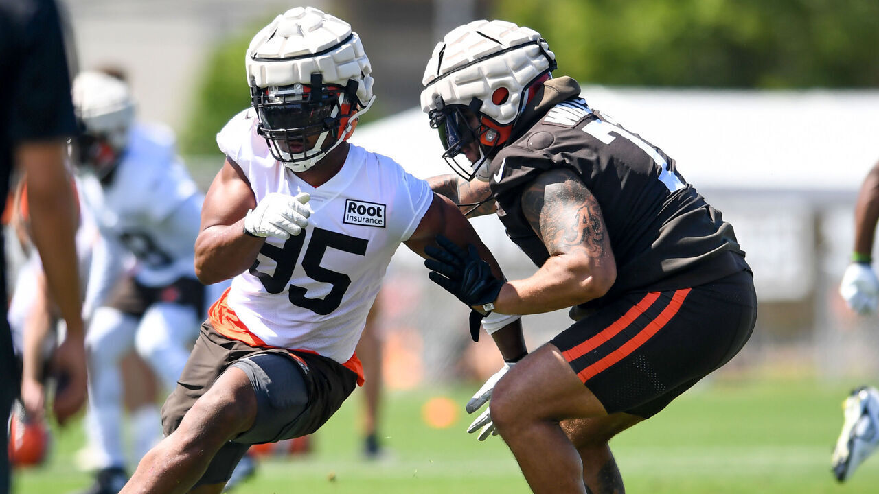 BEREA, OH - JULY 30: Myles Garrett #95 of the Cleveland Browns rushes against Jedrick Wills Jr. #71 during Cleveland Browns training camp at CrossCountry Mortgage Campus on July 30, 2022 in Berea, Ohio.
