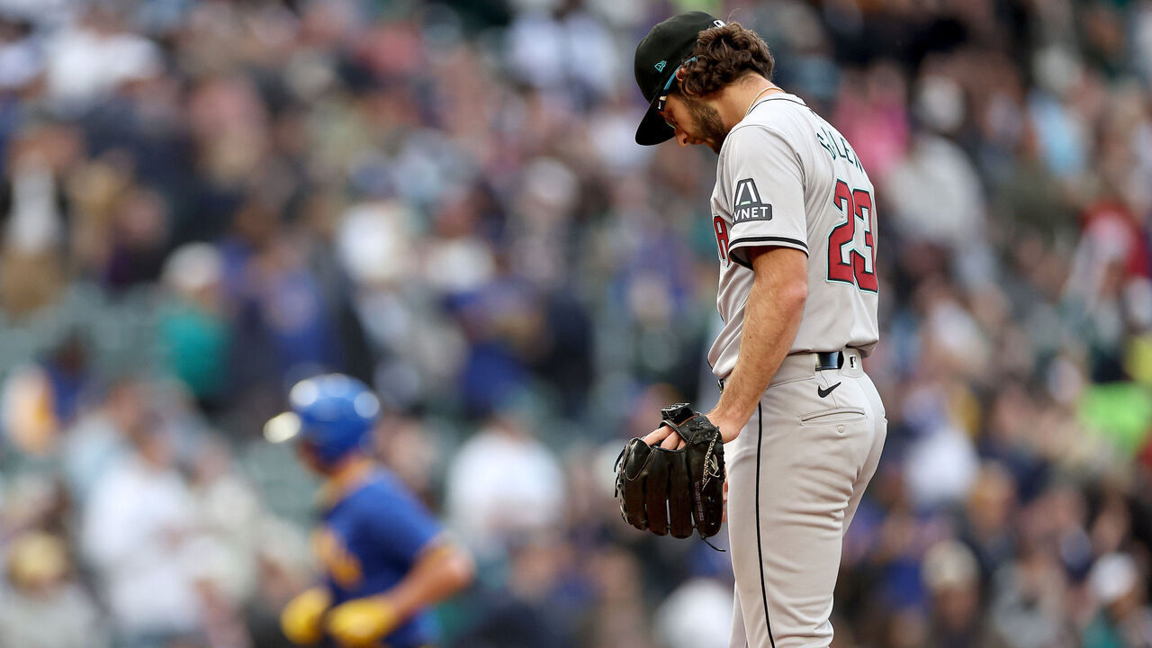 SEATTLE, WASHINGTON - APRIL 26: Zac Gallen #23 of the Arizona Diamondbacks reacts after giving up a home run to Mitch Garver #18 of the Seattle Mariners during the second inning at T-Mobile Park on April 26, 2024 in Seattle, Washington.