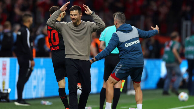 LEVERKUSEN, GERMANY - APRIL 27: Xabi Alonso, Head Coach of Bayer Leverkusen, reacts after Robert Andrich of Bayer Leverkusen (not pictured) scores his team's second goal during the Bundesliga match between Bayer 04 Leverkusen and VfB Stuttgart at BayArena on April 27, 2024 in Leverkusen, Germany.