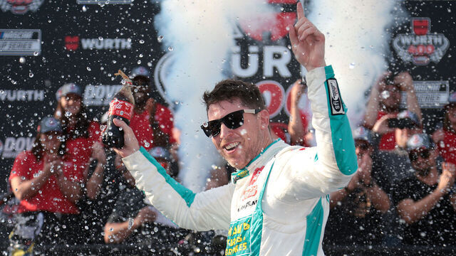 DOVER, DELAWARE - APRIL 28: Denny Hamlin, driver of the #11 Mavis Tire Toyota, celebrates in victory lane after winning the NASCAR Cup Series Würth 400 at Dover International Speedway on April 28, 2024 in Dover, Delaware.