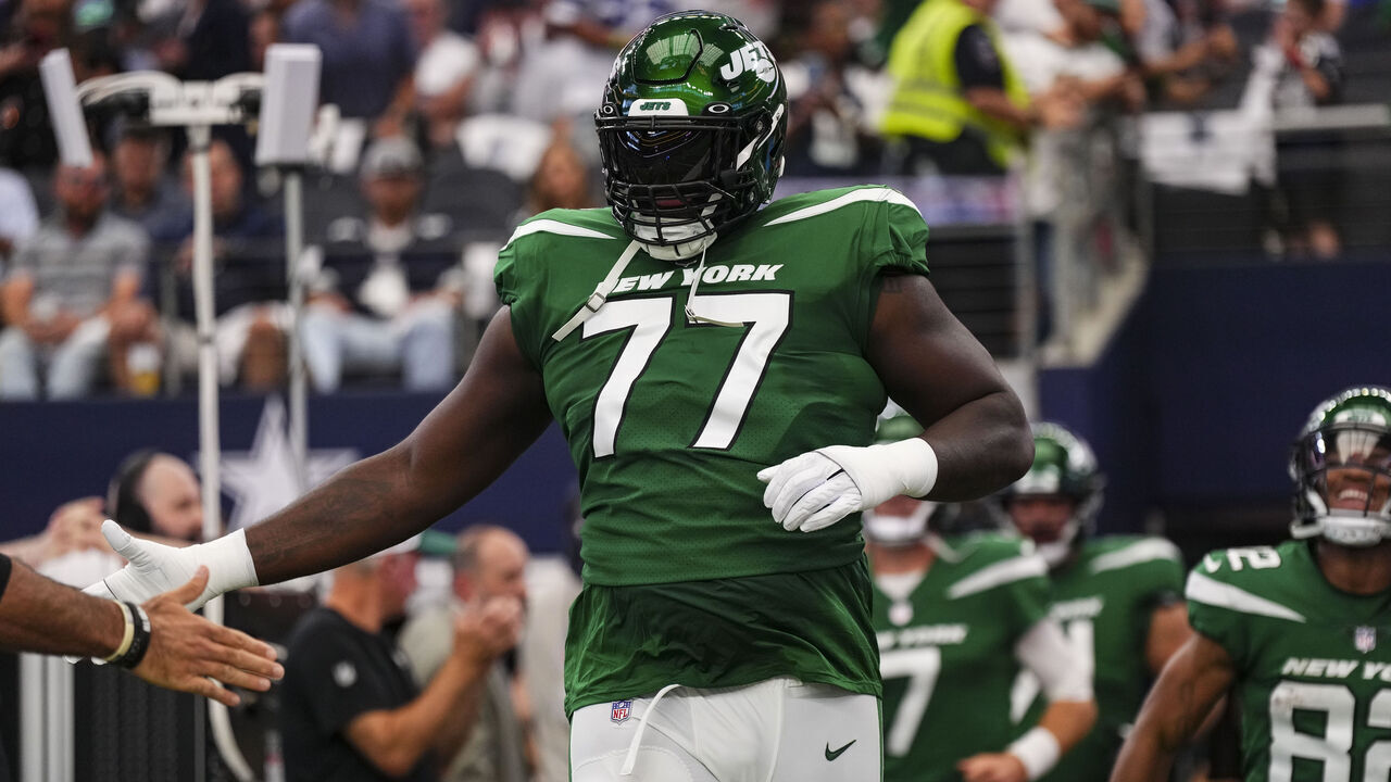 ARLINGTON, TX - SEPTEMBER 17: Mekhi Becton #77 of the New York Jets runs out onto the field prior to a football game at AT&T Stadium on September 17, 2023 in Arlington, Texas.