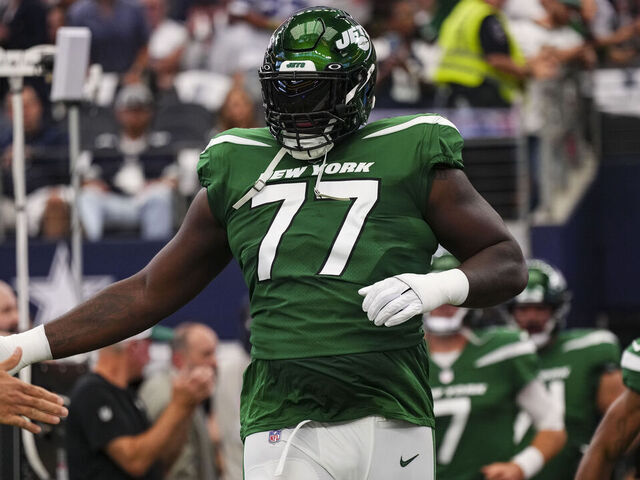 ARLINGTON, TX - SEPTEMBER 17: Mekhi Becton #77 of the New York Jets runs out onto the field prior to a football game at AT&T Stadium on September 17, 2023 in Arlington, Texas.