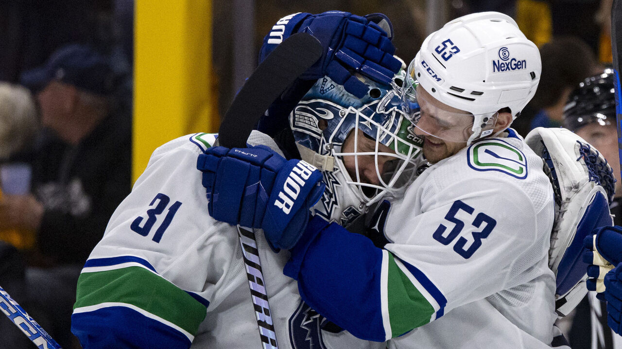 NASHVILLE, TENNESSEE - APRIL 28: Arturs Silovs #31 and Teddy Blueger #53 of the Vancouver Canucks celebrate after defeating the Nashville Predators during overtime of Game Four of the First Round of the 2024 Stanley Cup Playoffs at Bridgestone Arena on April 28, 2024 in Nashville, Tennessee.