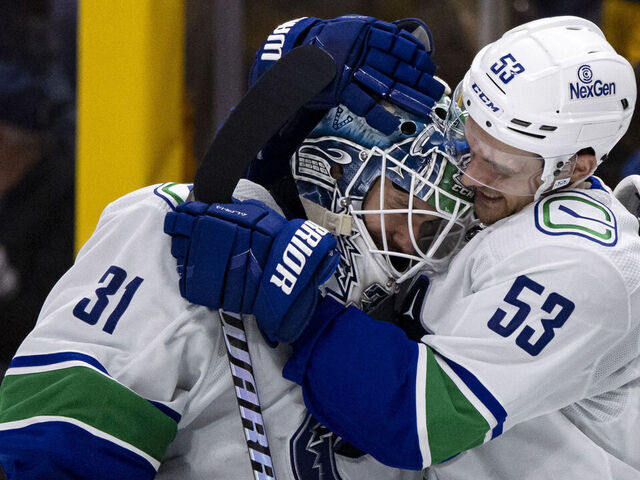NASHVILLE, TENNESSEE - APRIL 28: Arturs Silovs #31 and Teddy Blueger #53 of the Vancouver Canucks celebrate after defeating the Nashville Predators during overtime of Game Four of the First Round of the 2024 Stanley Cup Playoffs at Bridgestone Arena on April 28, 2024 in Nashville, Tennessee.