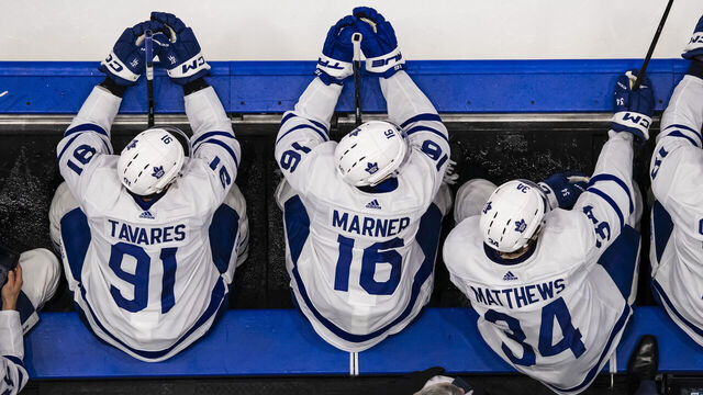 TAMPA, FL - APRIL 17: John Tavares #91, Mitch Marner #16, Auston Matthews #34 and Noah Gregor #18 of the Toronto Maple Leafs watch the play on the ice against the Tampa Bay Lightning at Amalie Arena on April 17, 2024 in Tampa, Florida.