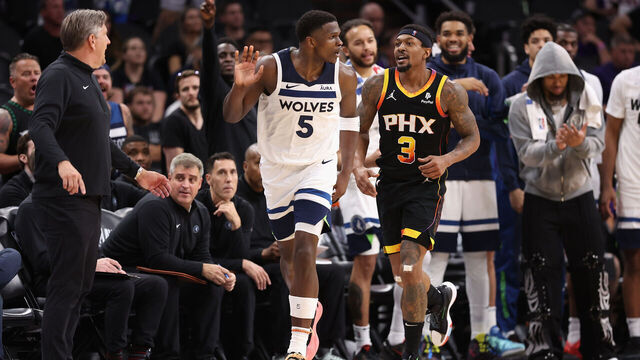 PHOENIX, ARIZONA - APRIL 26: Anthony Edwards #5 of the Minnesota Timberwolves reacts alongside head coach Chris Finch and Bradley Beal #3 of the Phoenix Suns during the second half of game three of the Western Conference First Round Playoffs at Footprint Center on April 26, 2024 in Phoenix, Arizona. The Timberwolves defeated the Suns 126-109. ˆ ˆ