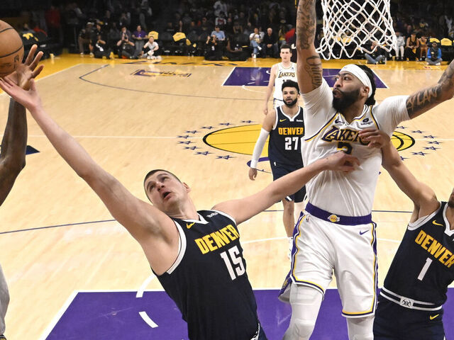 Los Angeles, CA - April 27: Nikola Jokic #15 of the Denver Nuggets rebounds over Anthony Davis #3 of the Los Angeles Lakers in the first half of game 4 of a first round NBA playoff basketball game at Crypto.com Arena in Los Angeles on Saturday, April 27, 2024.