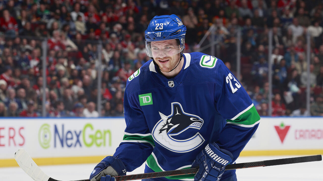 VANCOUVER, CANADA - MARCH 21: Elias Lindholm #23 of the Vancouver Canucks lines up for a face off during their NHL game against the Montréal Canadiens at Rogers Arena on March 21, 2024 in Vancouver, British Columbia, Canada.