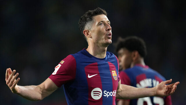 BARCELONA, SPAIN - APRIL 29: Robert Lewandowski of FC Barcelona celebrates scoring his team's fourth goal to compete his hat-trick during the LaLiga EA Sports match between FC Barcelona and Valencia CF at Estadi Olimpic Lluis Companys on April 29, 2024 in Barcelona, Spain.