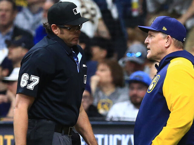 MILWAUKEE, WI - APRIL 29: Milwaukee Brewers manager Pat Murphy (21) discusses a play with umpire Ryan Additon (67) during a game between the Milwaukee Brewers and the Tampa Bay Rays at American Family Field on April 29, 2024 in Milwaukee, WI.