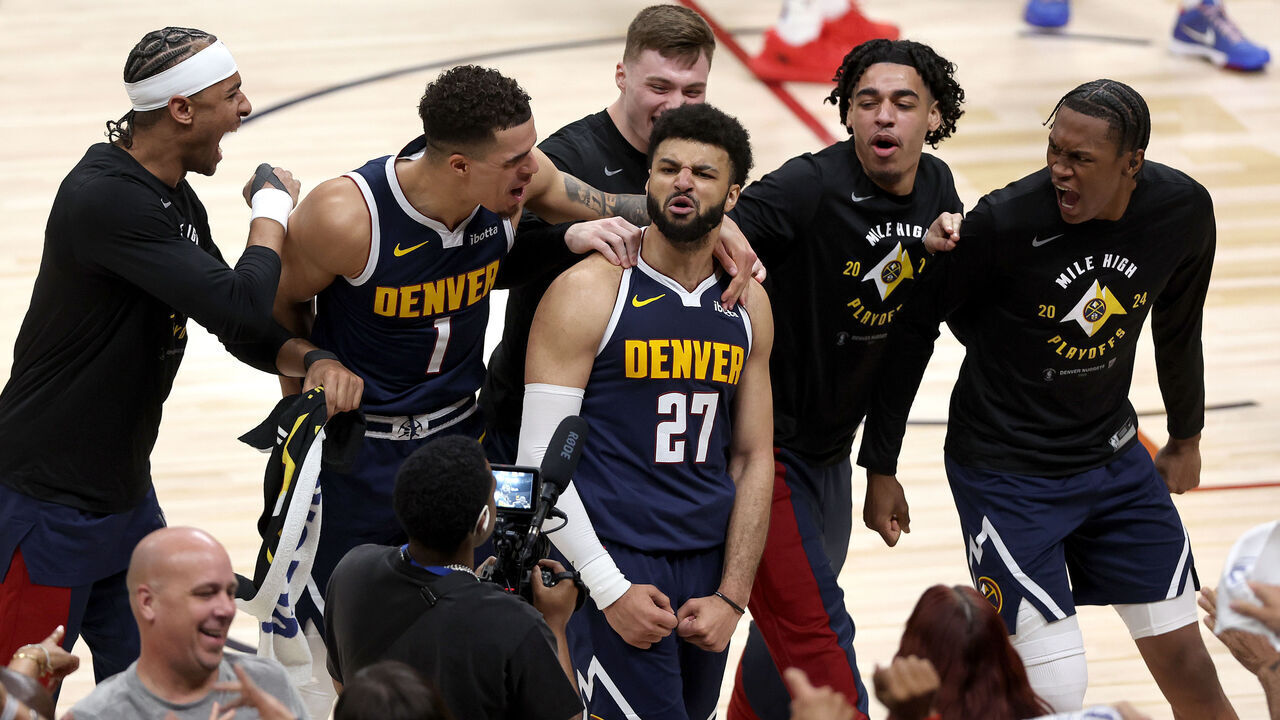 DENVER, COLORADO - APRIL 29: Jamal Murray #27 of the Denver Nuggets celebrates with his teammates after making a basket in the final seconds to defeat the Los Angeles Lakers during game five of the Western Conference First Round Playoffs at Ball Arena on April 29, 2024 in Denver, Colorado.