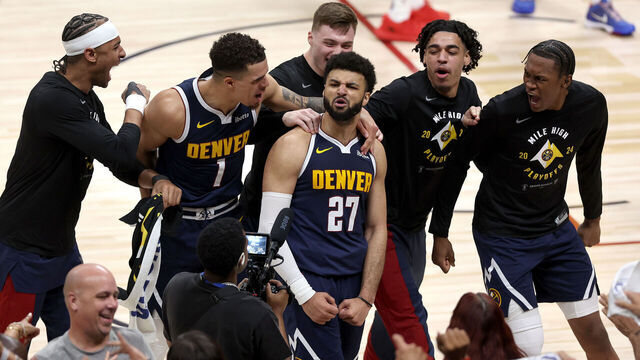 DENVER, COLORADO - APRIL 29: Jamal Murray #27 of the Denver Nuggets celebrates with his teammates after making a basket in the final seconds to defeat the Los Angeles Lakers during game five of the Western Conference First Round Playoffs at Ball Arena on April 29, 2024 in Denver, Colorado.