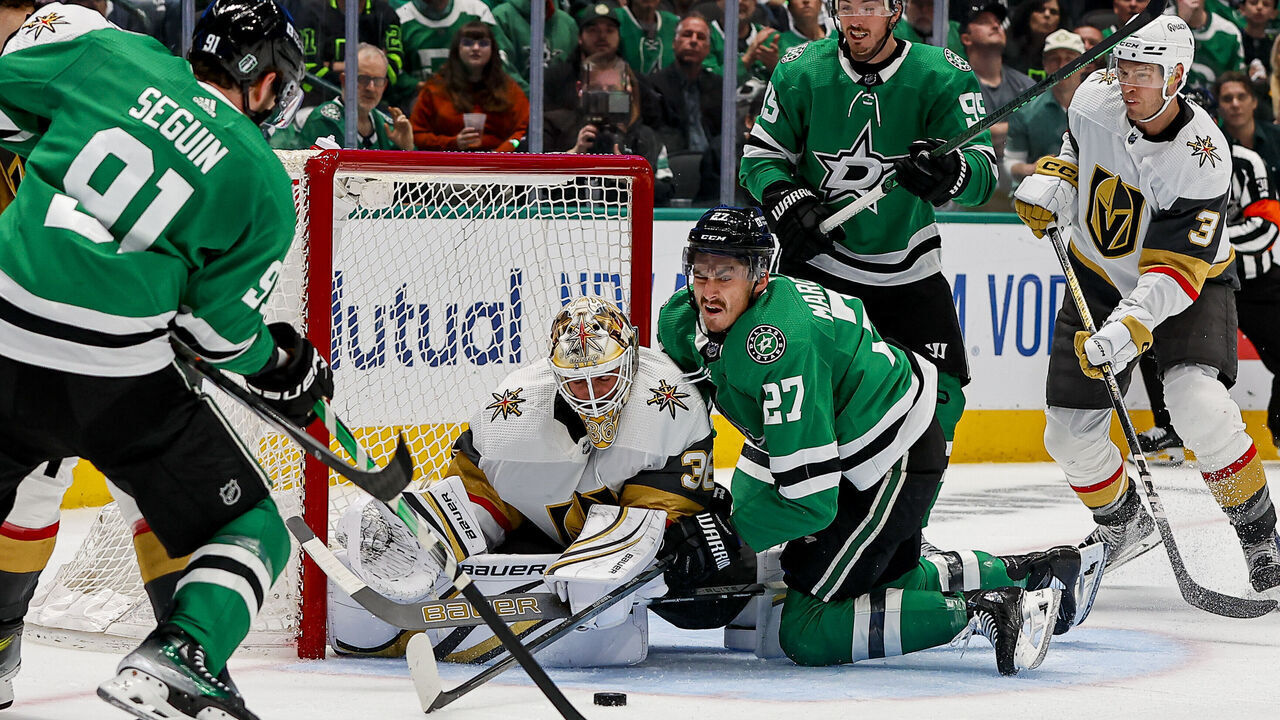 DALLAS, TX - APRIL 24: Dallas Stars left wing Mason Marchment (27) crashes into Vegas Golden Knights goaltender Logan Thompson (36) chasing the puck during game two of the Western Conference First Round between the Dallas Stars and the Vegas Golden Knights on April 24, 2024 at American Airlines Center in Dallas, Texas.