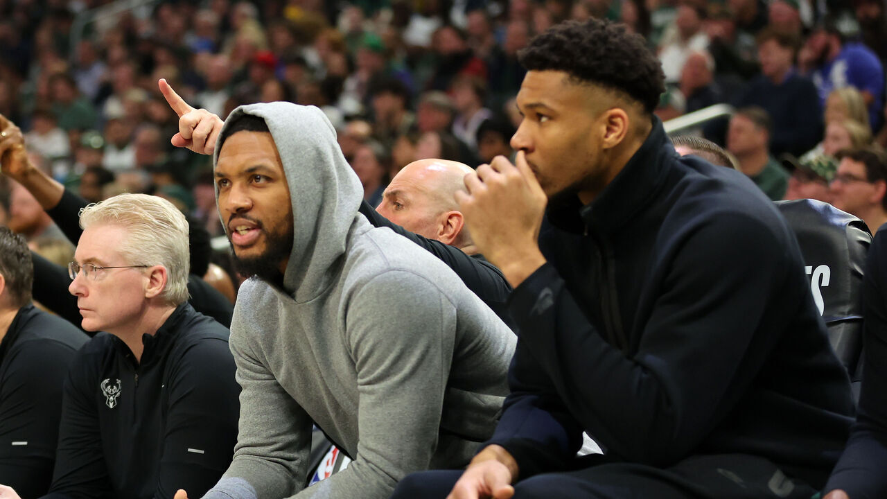 MILWAUKEE, WISCONSIN - APRIL 30: Damian Lillard #0 and Giannis Antetokounmpo #34 of the Milwaukee Bucks watch action during the first half of game five of the Eastern Conference First Round Playoffs against the Indiana Pacers at Fiserv Forum on April 30, 2024 in Milwaukee, Wisconsin.