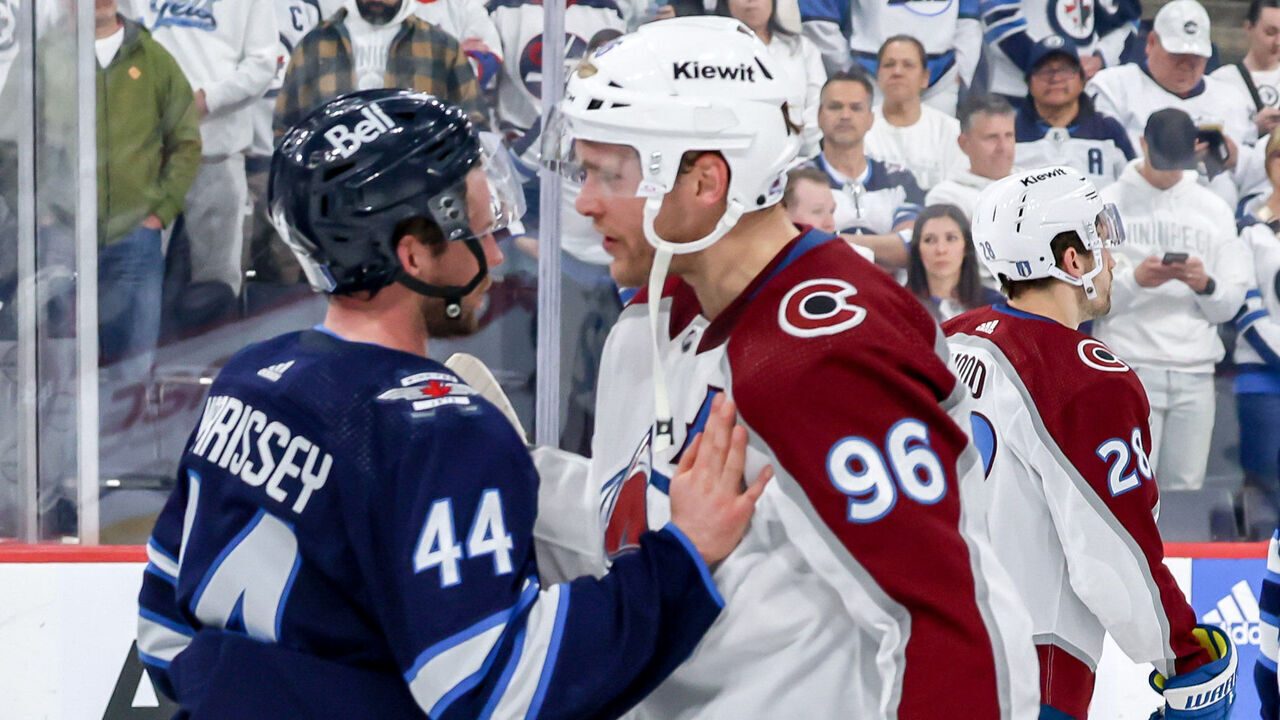 WINNIPEG, CANADA - APRIL 30: Josh Morrissey #44 of the Winnipeg Jets exchanges words with Mikko Rantanen #96 of the Colorado Avalanche following a 6-3 victory by the Avalanche in Game Five of the First Round of the 2024 Stanley Cup Playoffs at the Canada Life Centre on April 30, 2024 in Winnipeg, Manitoba, Canada. The Avalanche win the series 4-1.