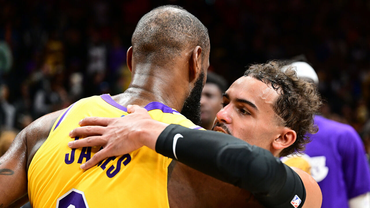 ATLANTA, GA - DECEMBER 30: LeBron James #6 of the Los Angeles Lakers embraces Trae Young #11 of the Atlanta Hawks after the game against the Atlanta Hawks on December 1, 2022 at State Farm Arena in Atlanta, Georgia. NOTE TO USER: User expressly acknowledges and agrees that, by downloading and/or using this Photograph, user is consenting to the terms and conditions of the Getty Images License Agreement. Mandatory Copyright Notice: Copyright 2022 NBAE