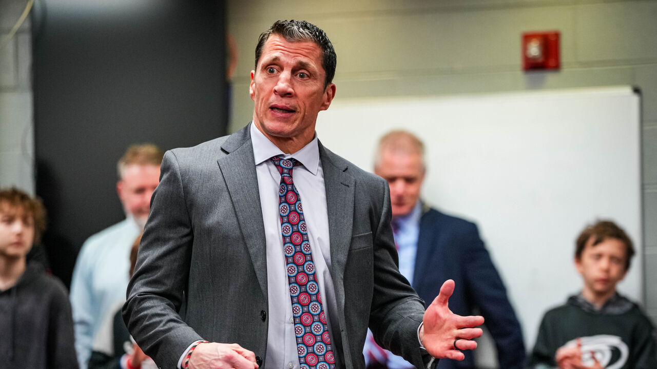 RALEIGH, NORTH CAROLINA - MARCH 24: Head coach Rod Brind'Amour of the Carolina Hurricanes speaks to his team in the locker room after a win over the Toronto Maple Leafs at PNC Arena on March 24, 2024 in Raleigh, North Carolina.